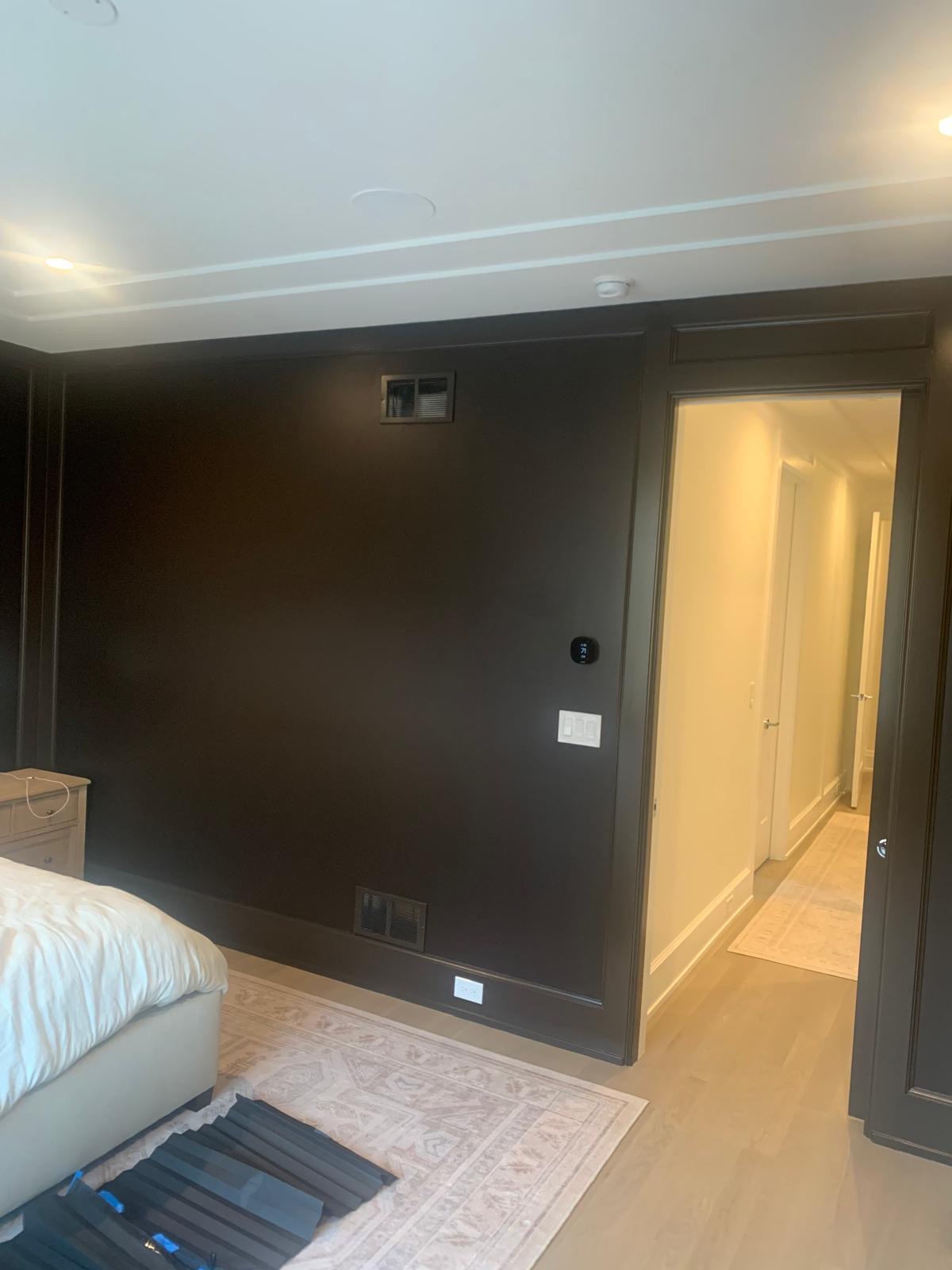 Dark painted bedroom with elegant finish